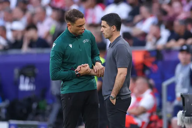Mikel Arteta manager / head coach of Arsenal speaks with the fourth official