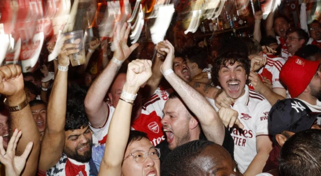 Arsenal fans celebrates after Kai Havertz scores