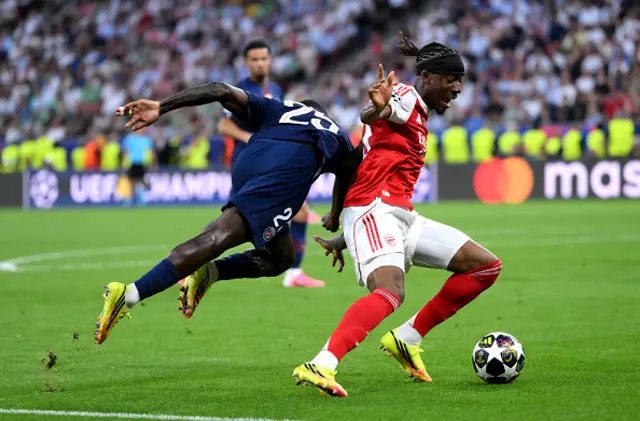 Noni Madueke of Arsenal is challenged by Nuno Mendes