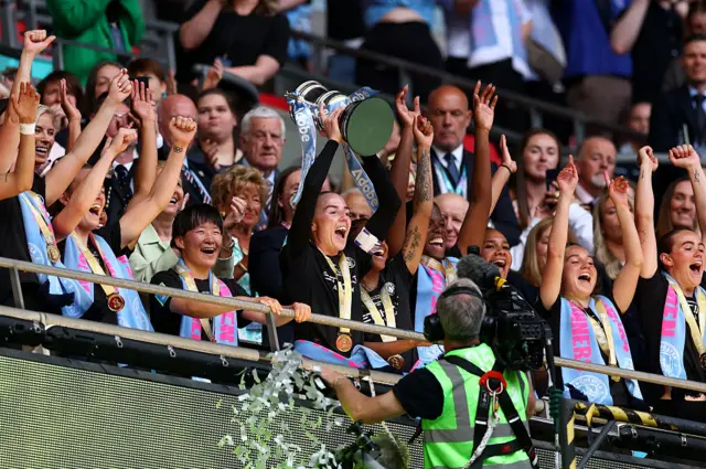 Alex Greenwood of Manchester City lifts the Women's FA Cup Troph