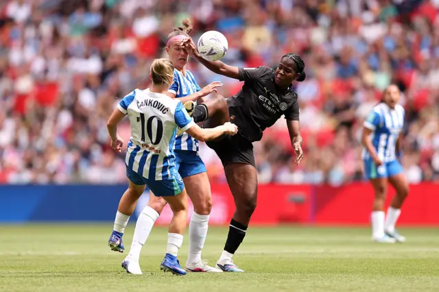 Khadija Shaw tries to get a high ball under control