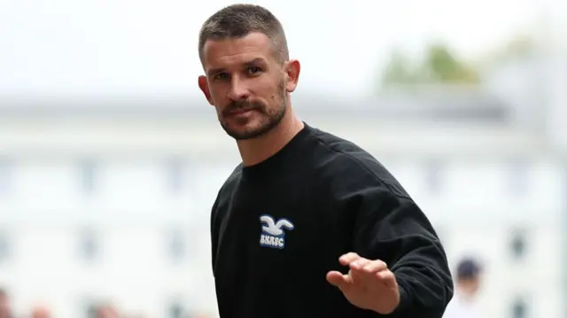 Dario Vidosic, Manager of Brighton & Hove Albion, arrives at the stadium