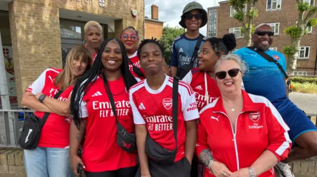 Precious Robinson and her family pictured in Arsenal shirts at the parade