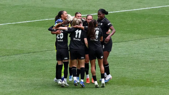 The Manchester City team celebrates victory