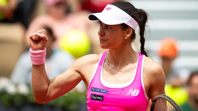 Sorana Cirstea celebrates with a clenched fist