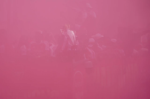 Red smoke filling the the screen as Arsenal FC holds up the trophy (scene is barely visible because of the smoke)