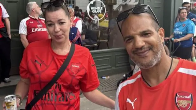 Barry and his partner in Arsenal tees.