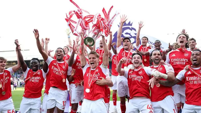 Martin Odegaard of Arsenal lifts the Premier League trophy as players of Arsenal celebrate, as they are crowned the Champions of the Premier League for the 2025/26 Season, after the Premier League match between Crystal Palace and Arsenal at Selhurst Park on May 24