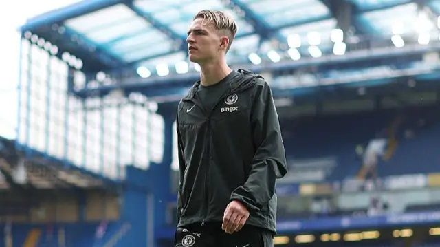 Jesse Derry of Chelsea inspects the pitch