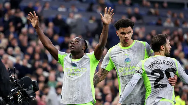 Jeremy Doku of Manchester City celebrates scoring his team's first goal