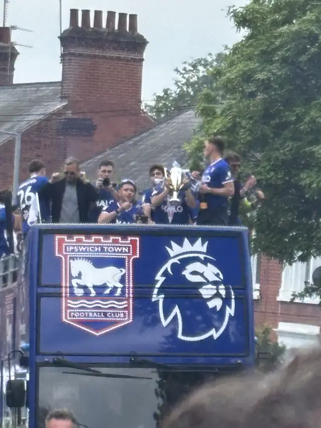 Ipswich Town players and staff atop an open-top bus