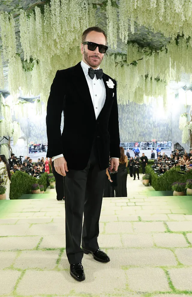 Designer Tom Ford in a black suit