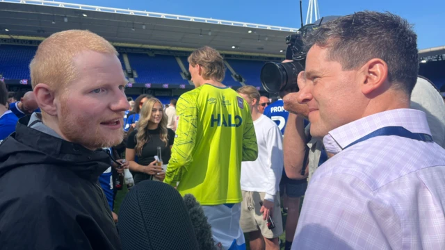 Ed Sheeran speaking to BBC Look East's Tom Williams at Portman Road Stadium.