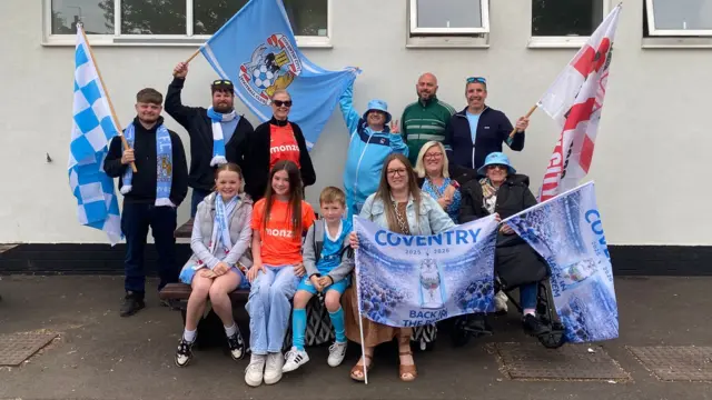 A group of fans outside a pub
