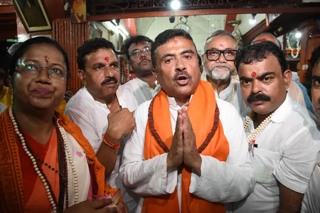 Senior BJP leader Suvendu Adhikari, contesting from the Bhabanipur and Nandigram assembly constituencies, offers prayers at the Firinghi Kalibari Temple before participating in a road show alongside BJP candidates