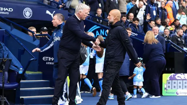 Everton manager David Moyes shakes hands with Manchester City manager Pep Guardiola