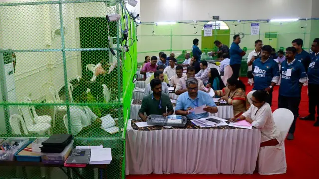 Election officials count votes at a vote counting center for the Kerala state assembly elections in Kochi, India, on May 4, 2026
