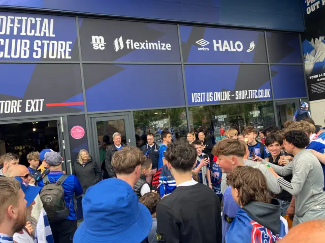 A group fo Ipswich Town supporters gathered as some play the drums