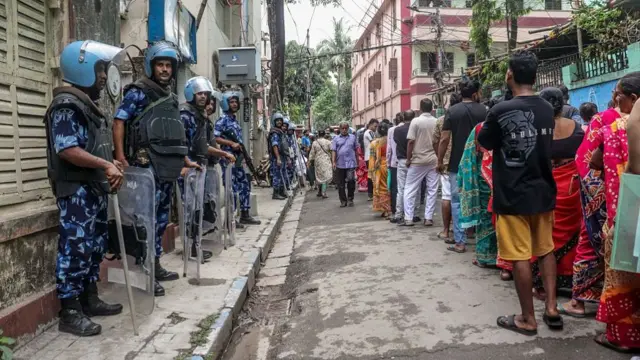 CRPF personnel are seen outside a polling station in Kolkata, India, on April 29, 2026, during the last phase of assembly elections in West Bengal.