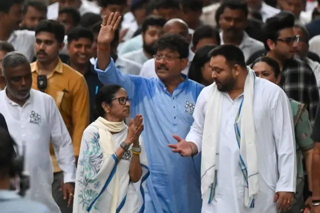 KOLKATA, INDIA - APRIL 27: RJD leader Tejashwi Yadav joins with Chief Minister and AITC chairperson Mamata Banerjee during a padayatra (rally) from Jadavpur to Gopal Nagar on the last day of campaign ahead of 2nd phase of Assembly Election on April 27, 2026 in Kolkata, India. (Photo by Samir Jana/Hindustan Times via Getty Images)