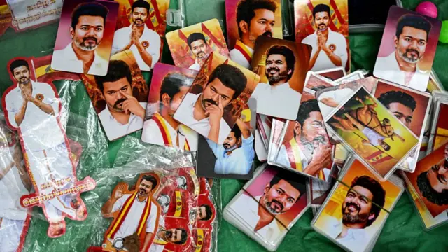 A vendor sells pictures of Indian actor and Tamilaga Vettri Kazhagam (TVK) party president C. Joseph Vijay during vote counting for the Tamil Nadu Legislative Assembly elections, at the party headquarters in Chennai on May 4, 2026