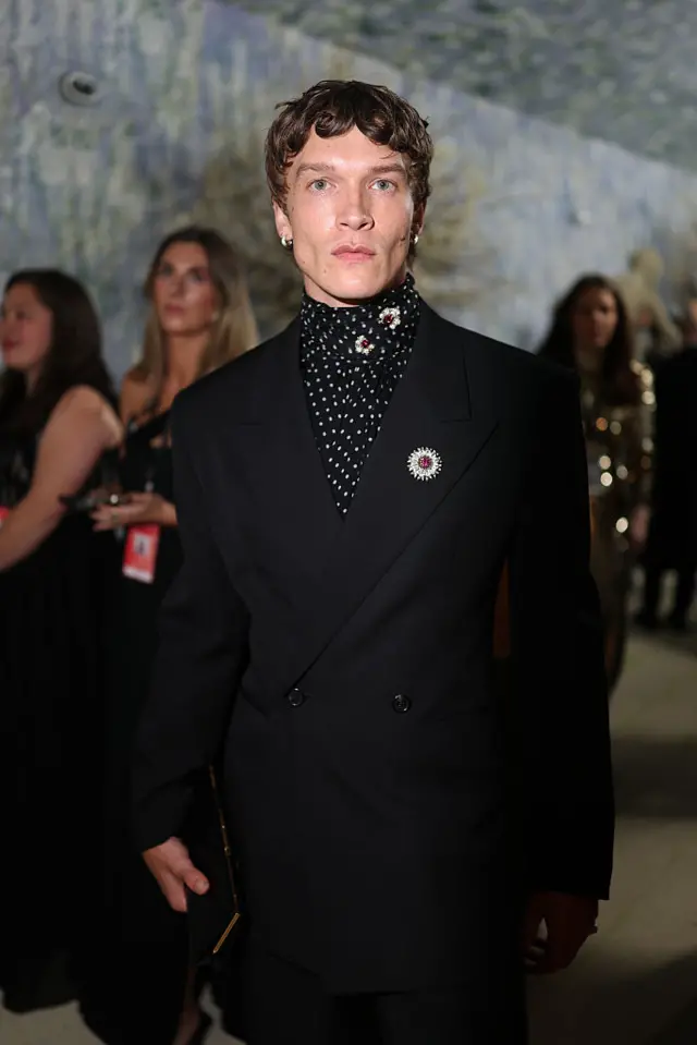 Connor Storrie, star of the hit show Heated Rivalry, walks the red carpet