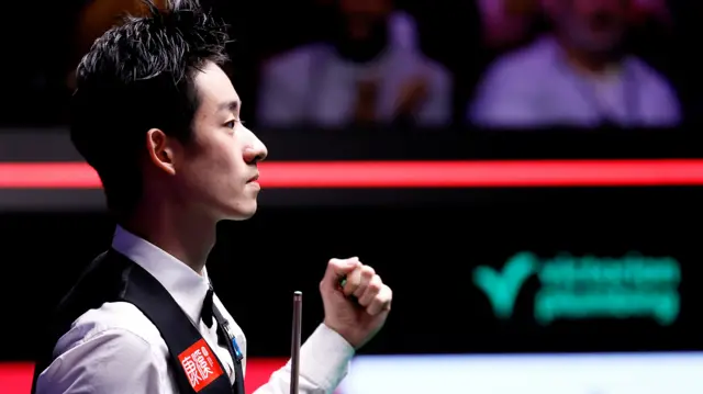 Wu Yize celebrates