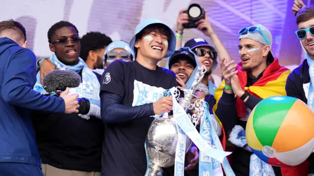 Coventry City's Tatsuhiro Sakamoto with the trophy