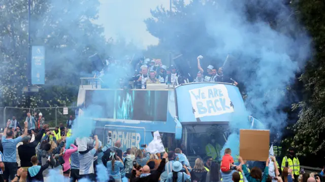 Coventry City players on the parade bus as they celebrate promotion to Premier League
