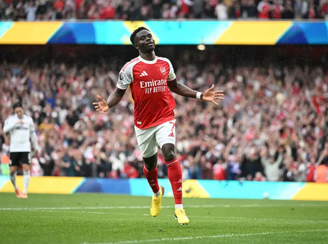 Bukayo Saka celebrates