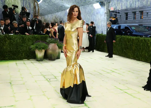 Actress Grace Gummer wears a metallic golden look