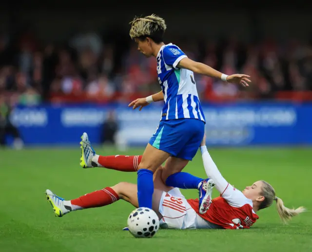 Russo slides into a tackle on Minami