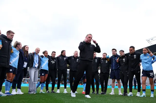 Andree Jeglertz, head coach of Manchester City speaks during a huddle