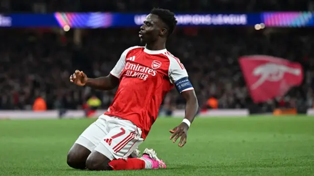 Bukayo Saka celebrates scoring for Arsenal against Atletico Madrid