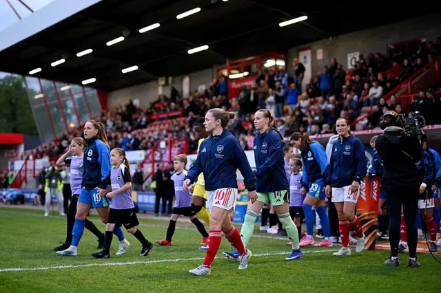 The captains lead the teams out