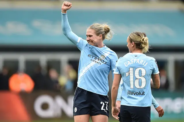 Rebecca Knaak shakes her fist at the fans after scoring