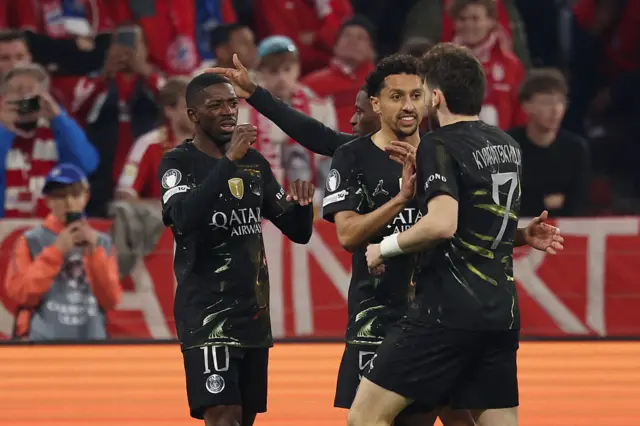 Paris Saint-Germain's French forward #10 Ousmane Dembele (L) celebrates