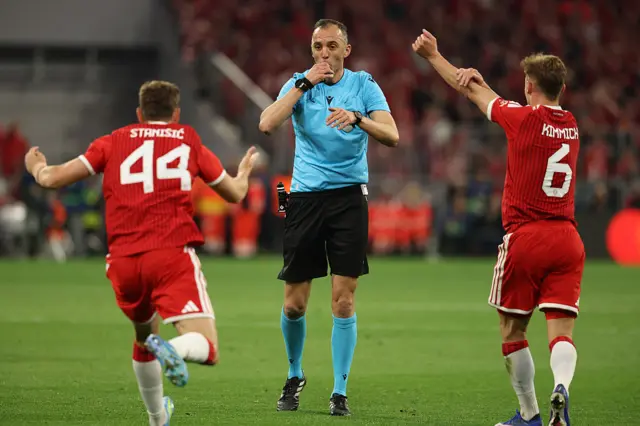 Bayern Munich's German midfielder #06 Joshua Kimmich (R) and Bayern Munich's Croatian defender #44 Josip Stanisic demand a penalty