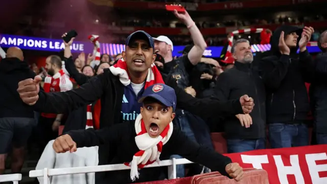 A young fan of Arsenal celebrates victory after the UEFA Champions League 2025/26 Semi Final Second Leg m