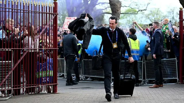 Aston Villa manager Unai Emery walks past fans into Villa Park
