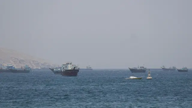 hips and boats in the Strait of Hormuz, Musandam, Oman.