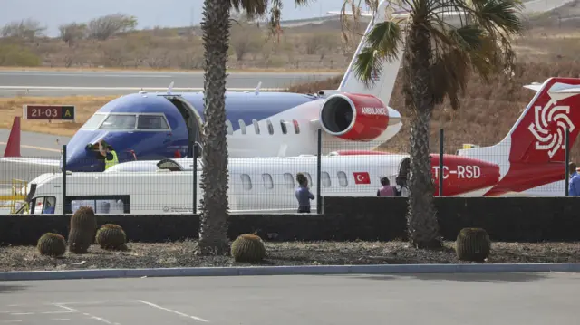 An air ambulance waits at Nelson Mandela International Airport for three passengers from the Dutch cruise ship MV Hondius, to be evacuated to the Netherlands,