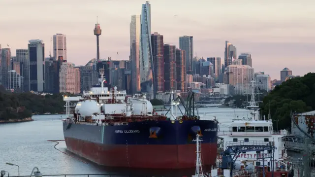 A crude oil and product tanker, sits at Viva Energy Australia's Gore Bay fuel terminal overlooking the city skyline in Sydney.