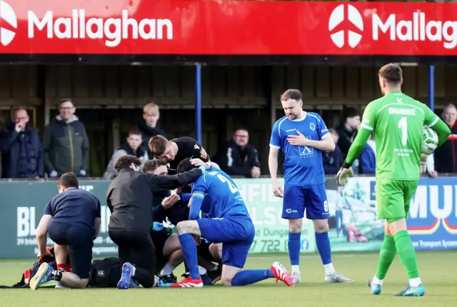 Dungannon Swifts defender Danny Wallace receives treatment