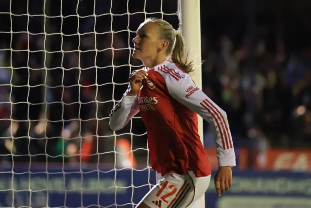 Maanum holds the Arsenal badge on her shirt after scoring