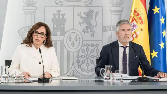 The Minister of Health, Monica Garcia, and the Minister of the Interior, Fernando Grande-Marlaska, speaking to reporters in Madrid