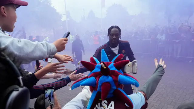 Abraham greets fans as the Villa team arrive to Villa Park