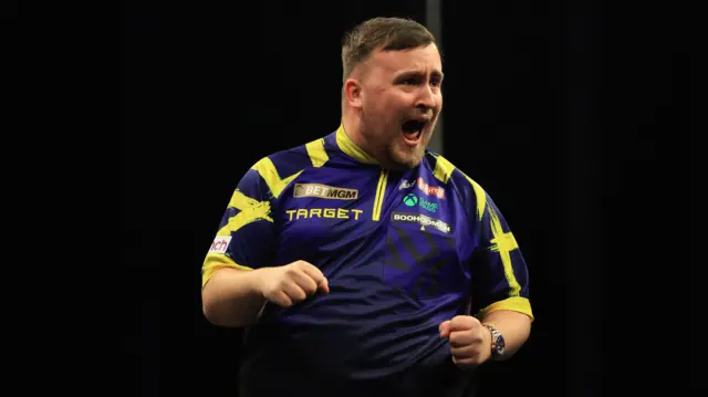 Luke Littler reacts during his match against Michael van Gerwen on night fourteen of the BetMGM Premier League 2026 at First Direct Bank, Leeds