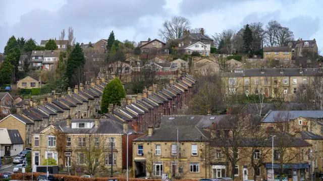 A shot of rows of houses on a hillside in Batley