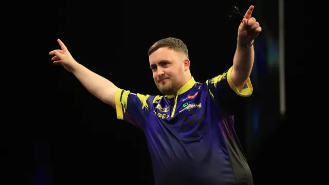 Luke Littler reacts during his match against Michael van Gerwen on night fourteen of the BetMGM Premier League 2026 at First Direct Bank, Leeds